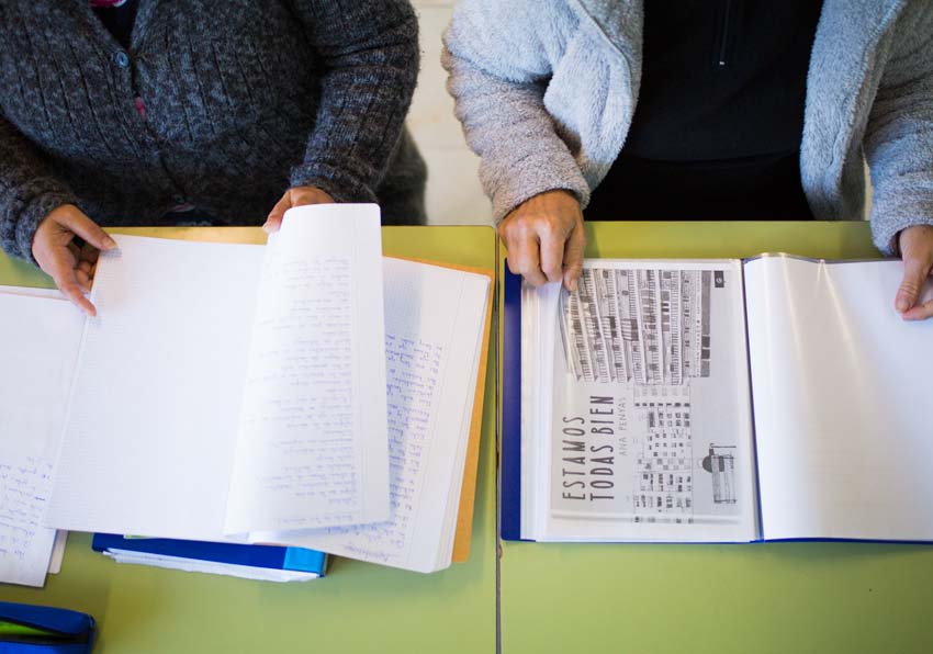 Two people reading documents